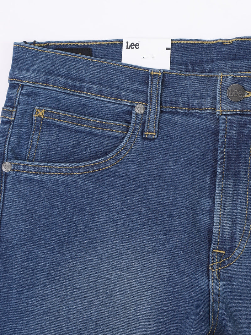 กางเกงยีนส์ผู้ชาย RAMONE FIT เอวต่ำ ทรงเข้ารูป สียีนส์กลาง